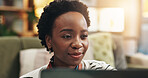Laptop, relax and smile with black woman in living room of home for browsing or streaming. Computer, internet and subscription with happy person in apartment on weekend morning for break or free time