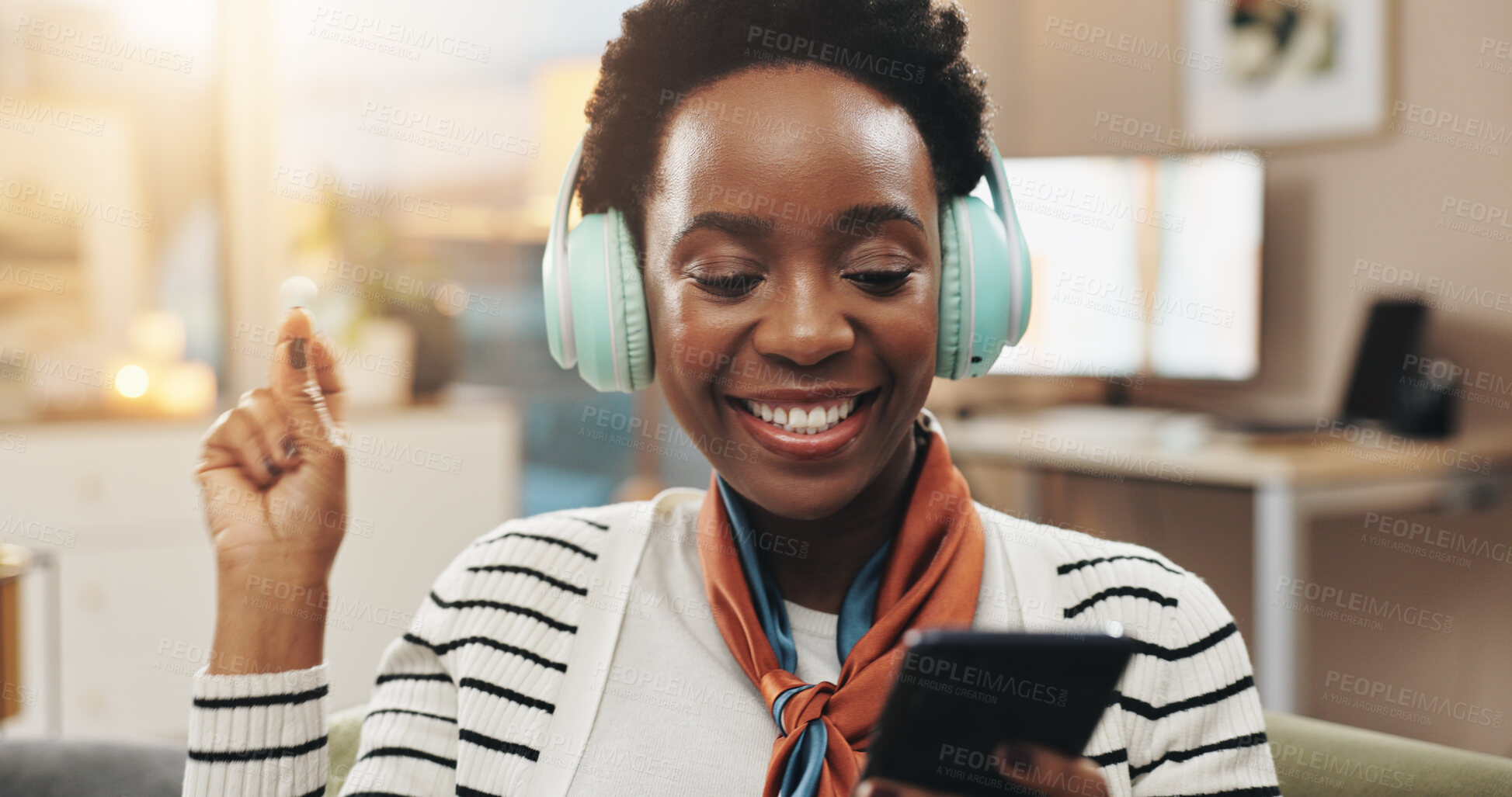Buy stock photo Phone, black woman and dancing with headphones in home for music playlist, audio album and streaming subscription. Dancer, happy and smartphone for social media video and listening to podcast on sofa