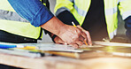 Collaboration, hands and writing with construction worker people closeup on building site for planning. Architecture, blueprints and floor plan with engineering team on location for development