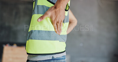 Buy stock photo Hands, construction worker and back pain for renovation, project and exhausted with injury at site. Person, engineer and builder with burnout, muscle fatigue and spine strain with massage for relief