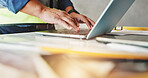 Man, laptop and hands with typing for construction, industrial inspection and building renovation of development. Engineer, technology and project management with maintenance for infrastructure