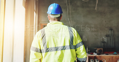 Buy stock photo Construction, walking and man with back on site for building inspection, property development or quality assurance. Safety manager, worker or check renovation progress for risk assessment or protocol