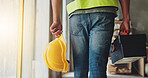 Construction, hands and walking with toolbox, helmet and safety compliance for industrial development. Contractor, person and tools on site for building maintenance, renovation project and inspection
