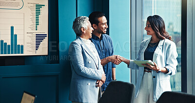 Buy stock photo Handshake, tablet and business people in office, conversation and charts for profit growth. Group, shaking hands and employees with tech, B2B deal and financial advisor with partnership and agreement