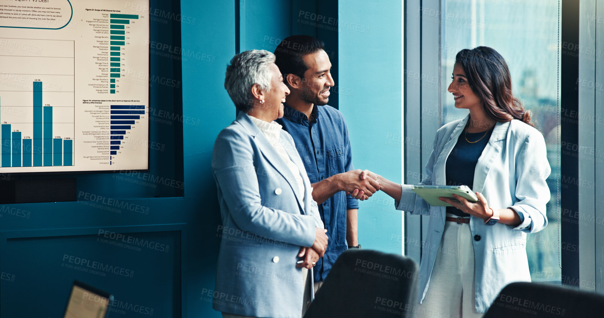 Buy stock photo Handshake, tablet and business people in office, conversation and charts for profit growth. Group, shaking hands and employees with tech, B2B deal and financial advisor with partnership and agreement