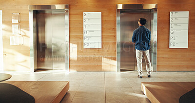 Buy stock photo Business, man and waiting at elevator in building for floor request, meeting appointment and destination. Back, professional person and office lift for work arrival, departure and morning routine