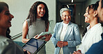 Talking, schedule or business people on tablet in lobby for research, teamwork or accounting proposal. Financial advisor, finance analysts or project agenda for budget report, funding or feedback