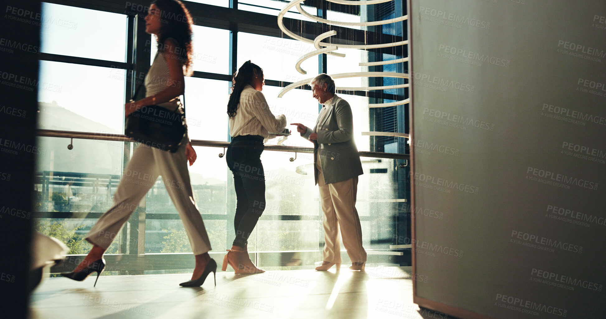 Buy stock photo Business women, tablet and discussion in lobby for architecture, creative design or laugh. Technology, happy manager and team planning construction project, building or training with mentor in office