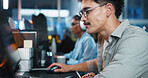 Office, businessman and reading with computer for coding, web development and scroll on website. Coworking, night and male programmer with technology for programming, software update and information