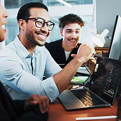 Web developer, smile and celebration in office for software, system or ...