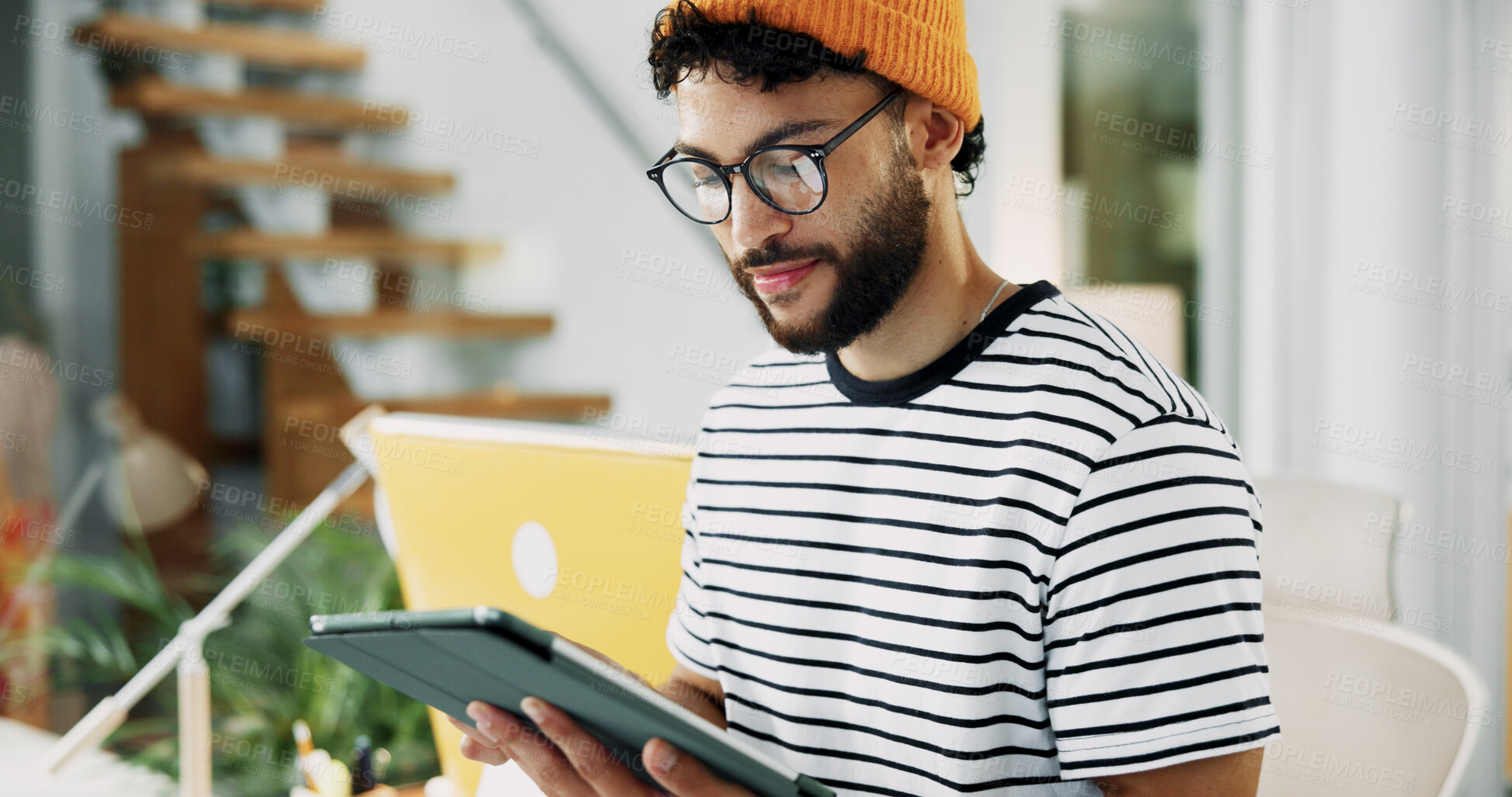 Buy stock photo Smile, man and reading on tablet in office for research, schedule update and review newsletter. Male journalist, digital and editing article, story information and feedback for magazine publication