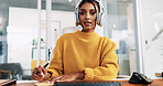 Woman, headset and writing at office with consulting, notes or portrait for technical support at IT startup. Person, agent and voip headphones for virtual advisory services, pc or help desk in Mexico