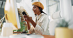 Smile, creative and woman with phone in office for chat, review article and contact for source check. Journalist, computer and mobile for research, reading email and information for story publication