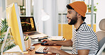 Creative, man and typing with computer in office for tracking metrics, social media campaign and performance data. Marketer, person and happy with insights for engagement or research marketing trends