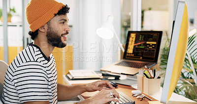 Buy stock photo Creative, man and typing on computer at desk for social media insights, campaign performance and data analysis. Marketing employee, person and happy with digital app for engagement metrics in office