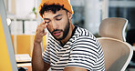Creative, tired and man with burnout in office for web development deadline, overworked and brain fog. Designer, employee and exhausted at agency for website testing crisis, overwhelmed or eye strain