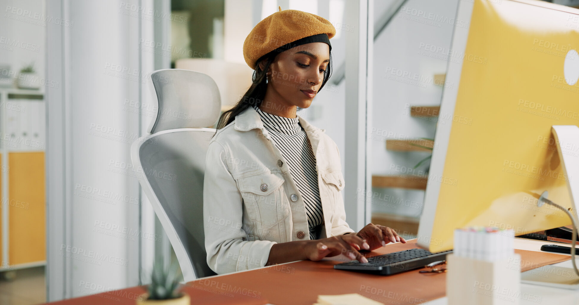 Buy stock photo Creative, woman and typing on computer at desk for social media campaign, KPI tracking or trends research. Digital marketing specialist, serious person and tech for online engagement or data analysis