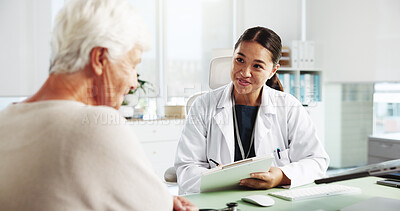 Buy stock photo Senior woman, happy doctor and consultation with clipboard for healthcare report, symptoms or checkup. Medical professional, appointment and talking to patient for help or writing results in hospital