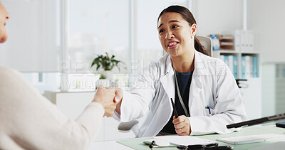 Buy stock photo Doctor, senior woman and smile with handshake at clinic for introduction, thanks or healthcare service. People, elderly patient and shaking hands for hello, happy or welcome to consulting at hospital