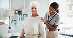 Physiotherapy, consulting and woman with mature patient for medical service, support and wellness. Healthcare, chiropractor and physical therapist with person for mobility, rehabilitation and help