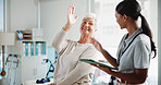 Senior woman, physiotherapist and happy with high five, support and results for recovery at clinic. People, elderly patient and doctor with tablet for report, progress and rehabilitation for injury