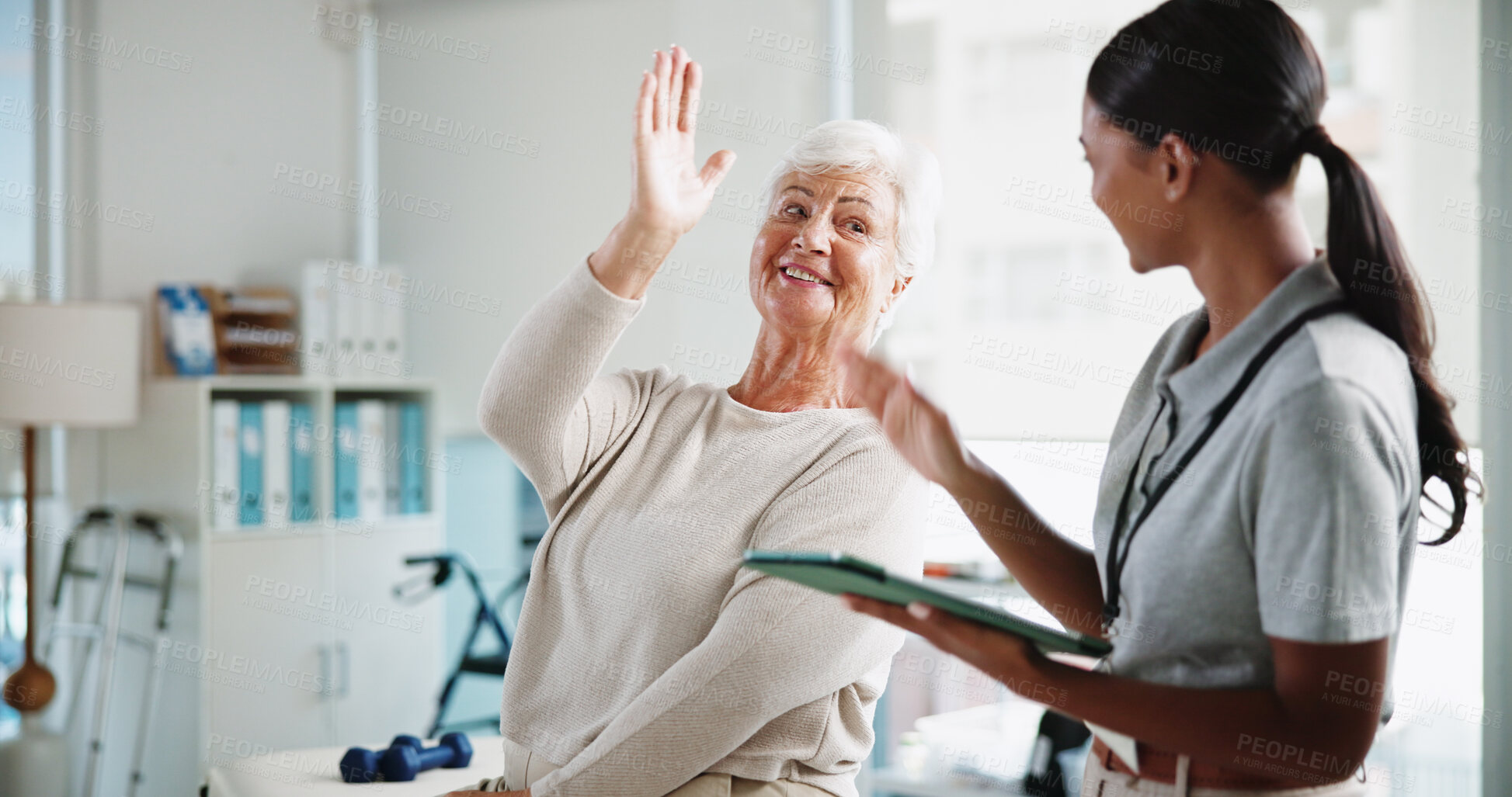 Buy stock photo Senior woman, physiotherapist and happy with high five, support and results for recovery at clinic. People, elderly patient and doctor with tablet for report, progress and rehabilitation for injury