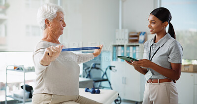 Buy stock photo Elderly woman, physiotherapist and resistance band with stretching, smile and healthcare services for recovery. People, happy and exercise with tablet, help and injury for rehabilitation at clinic