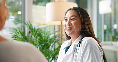 Buy stock photo Happy woman, doctor and talking with patient for medical diagnosis, prescription or advice at hospital. Female person, healthcare worker or surgeon with client or smile for health service at clinic