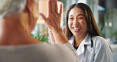 Buy stock photo Happy woman, healthcare and high five with senior patient for winning, good job or teamwork at hospital. Excited, female person or touch with smile for elderly care, success or positivity at clinic