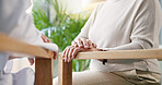 Chair, conversation and hands of senior couple outdoor in garden of home for bonding or retirement. Break, love and relax with old people speaking in backyard of apartment for security or trust