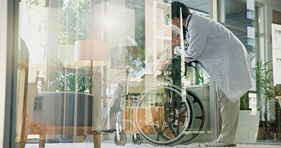 Buy stock photo Women, doctor and mature patient in wheelchair at hospital for healthcare, support and checkup. Glass office, person with disability and smile for medical service, good news and results with care