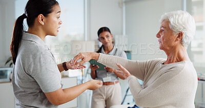 Buy stock photo Physiotherapist, old patient and help with arm mobility, advice or symptoms of elbow pain, arthritis and healthcare. Healing, rehabilitation and women in physiotherapy with senior care for muscle