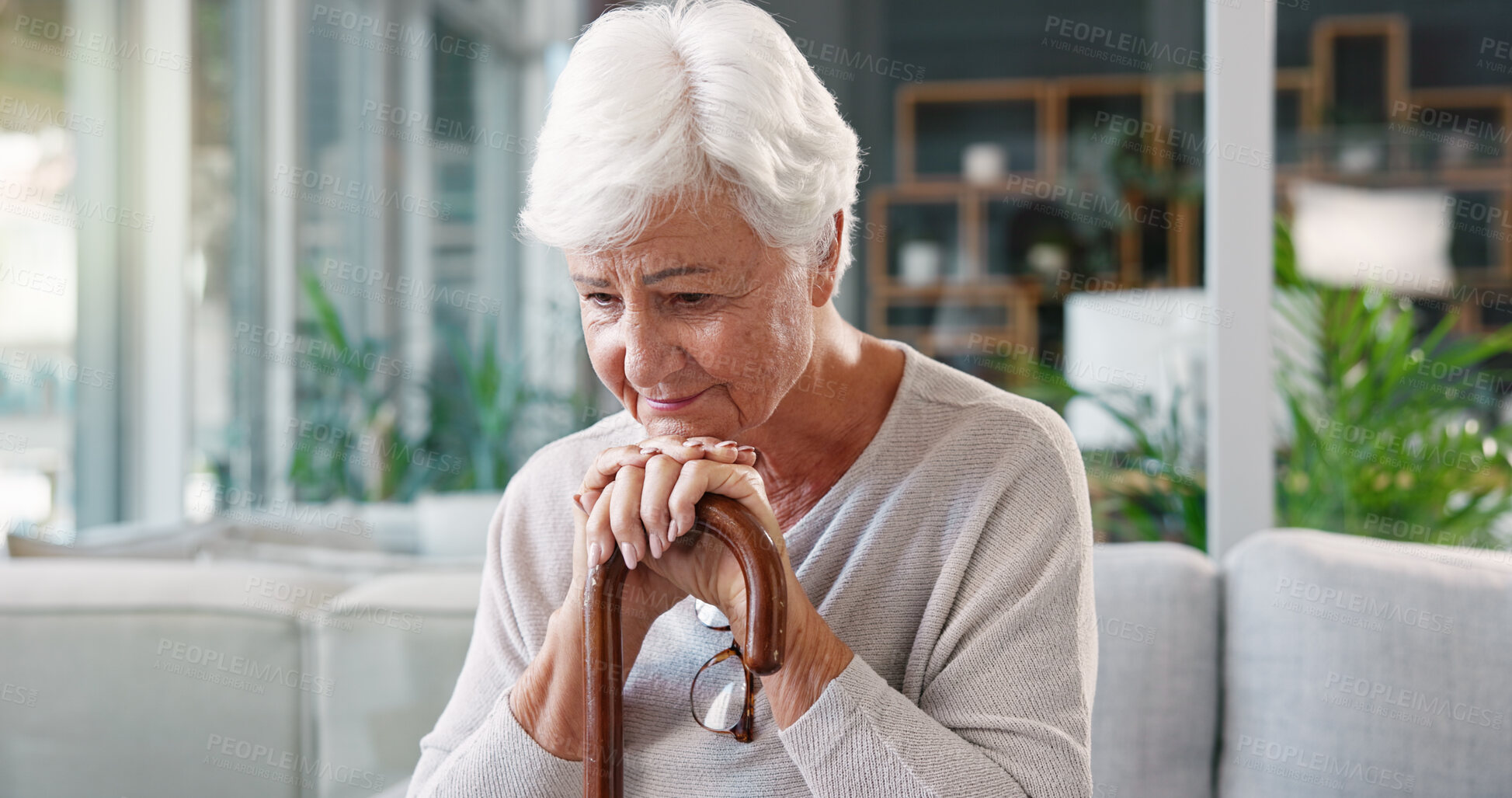 Buy stock photo Elderly woman, thinking and sad in nursing home with cane, depression and person with a disability alone. Pensioner, walking stick and retirement for arthritis, nostalgia and thoughts of memories