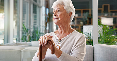 Buy stock photo Elderly woman, nostalgia and sad in nursing home with cane, depression and person with a disability alone. Pensioner, walking stick and retirement for arthritis, thinking and thoughts of memories