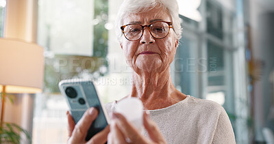 Buy stock photo Elderly woman, research and medication with phone for telehealth, information or prescription at home. Senior, female person or patient with mobile smartphone or pills for symptoms or side effects