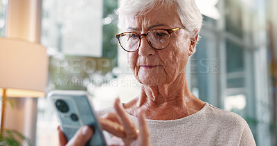 Buy stock photo Senior, woman and typing with phone in home for playing bingo game, word search or internet browsing. Retirement, elderly person or smartphone for reading ebook, online news or streaming subscription