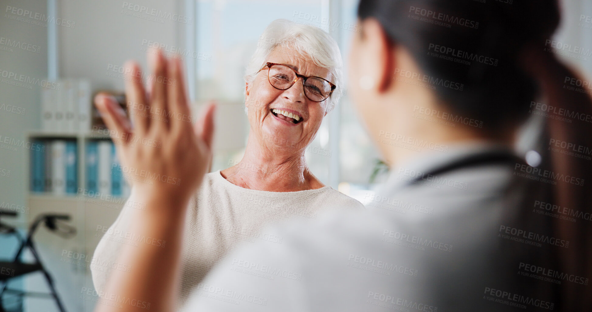Buy stock photo Physiotherapy, smile and senior patient with high five in clinic for rehabilitation success, good news or progress. Health worker, happy or old woman with celebration for medical results and recovery