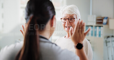 Buy stock photo High five, physiotherapist and elderly woman with consultation, conversation and support. Pensioner, senior patient or employee in office, gesture or wellness with healing, rehabilitation or recovery
