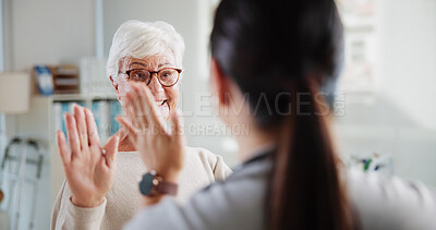 Buy stock photo Elderly patient, woman and high five in physio for rehabilitation success, good news or healing progress. Physical therapy, health worker or celebration in clinic for healthcare recovery or thank you