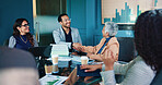 Business people, meeting and handshake with statistics for partnership, agreement or deal at office. Group, employees or team shaking hands with smile, graph or chart for b2b or performance review
