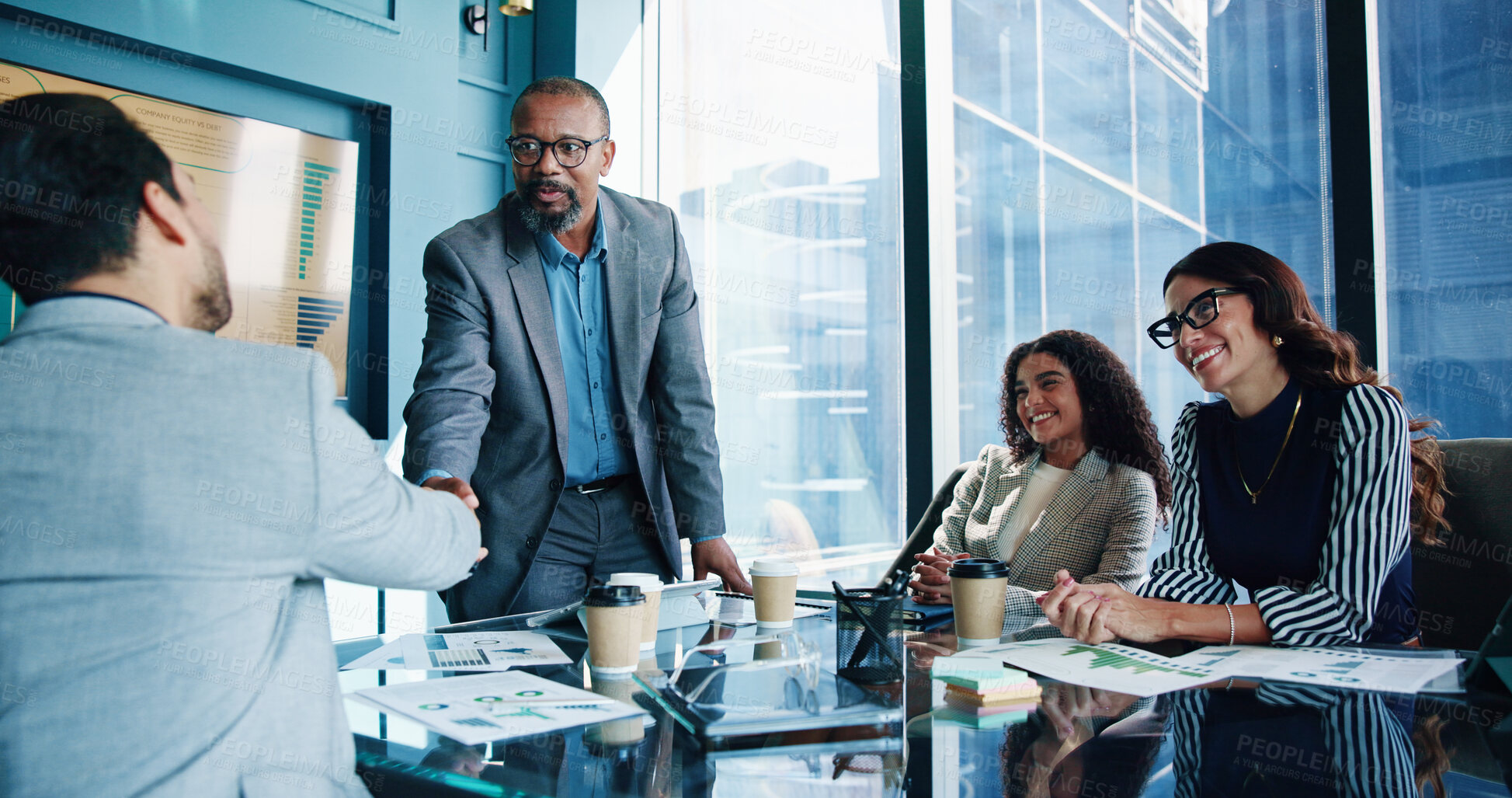 Buy stock photo Handshake, onboarding and business people in meeting, negotiation and financial success. Shaking hands, group and employees in workplace, b2b deal and thank you with partnership, invest and agreement