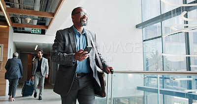 Buy stock photo Happy, businessman and walking with phone or suitcase for travel, job opportunity or career trip at airport. Man, employee or traveler with smile, mobile smartphone or luggage for commute or flight