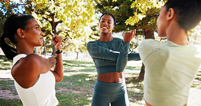 Buy stock photo Park, fitness and group of women stretching outdoor with friendship, talking or wellness exercise. Happy, sports and female athletes with arm warm up for health activity with conversation in nature
