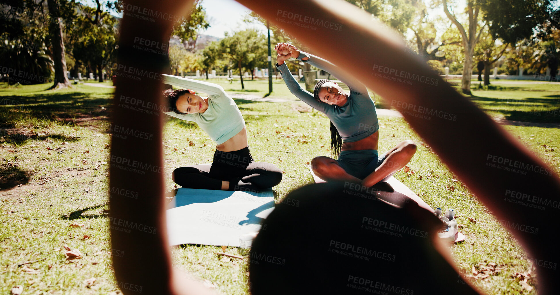 Buy stock photo Park, instructor and women with stretching for yoga, holistic exercise and arms balance with breathing. Nature, people and hands of yogi coach for instructions, wellness and mindfulness with fitness