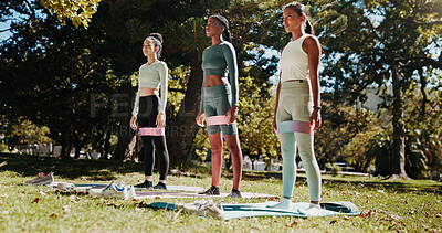 Buy stock photo Friends, yoga and women on mat in park for workout, exercise and practice for mobility in morning. Nature, pilates class and people with resistance band for wellness, health and wellbeing on grass