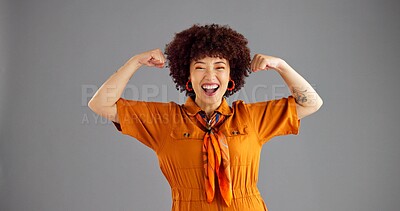 Buy stock photo Portrait, flexing arms and woman in studio, smile and power with confident personality on grey background. Face, happy person and model with gesture, space or female empowerment with challenge or win