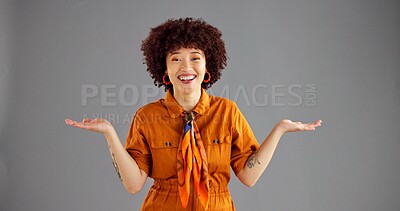 Buy stock photo Portrait, open hands and woman with smile, choice and selection on grey studio background. Face, person and model with gesture, questions and shrug with decision, mockup option and offer with opinion