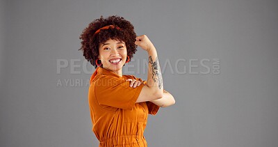 Buy stock photo Portrait, flexing arms and woman with victory, power or win with confidence on grey background. Vintage clothes, person or model with space, retro outfit or female empowerment with smile or strong