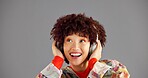 Headphones, thinking and woman in studio, listening to music and sound on grey background. Person, mockup space or happy model with confidence, fashion or headset with audio, streaming radio or smile