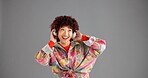 Headphones, smile and woman in studio, thinking and confidence on grey background. Person, mockup space or happy model with radio, fashion or headset with audio, streaming song or decision with sound